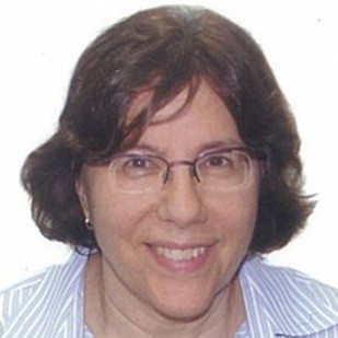 A photograph of a white woman with brown hair. 