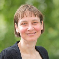 A photograph of a smiling white woman. 