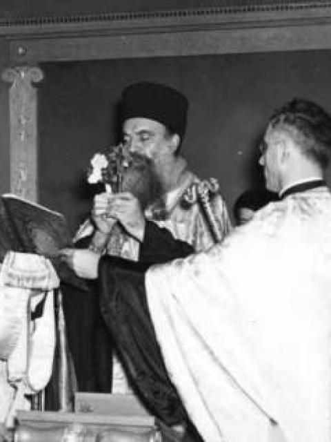Archbishop Athenagoras, assisted by his deacon and Reverend D. Sakellarides, blesses the Greek Room during its dedication