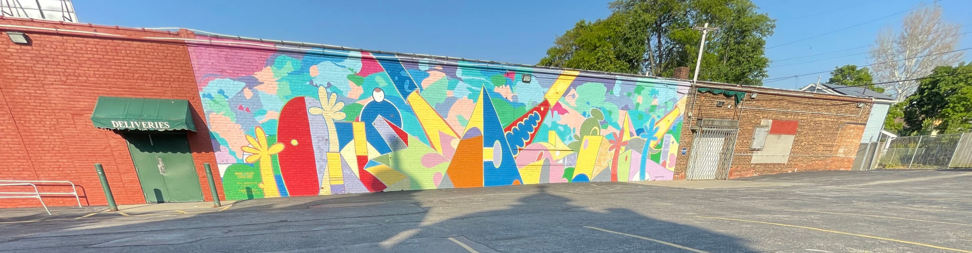 mural on a building near a parking garage